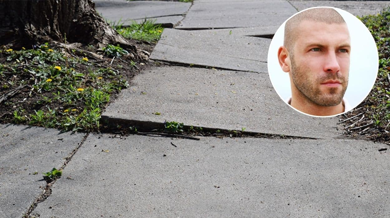 Man refuses to look back at uneven footpath paving he tripped on and shake his head
